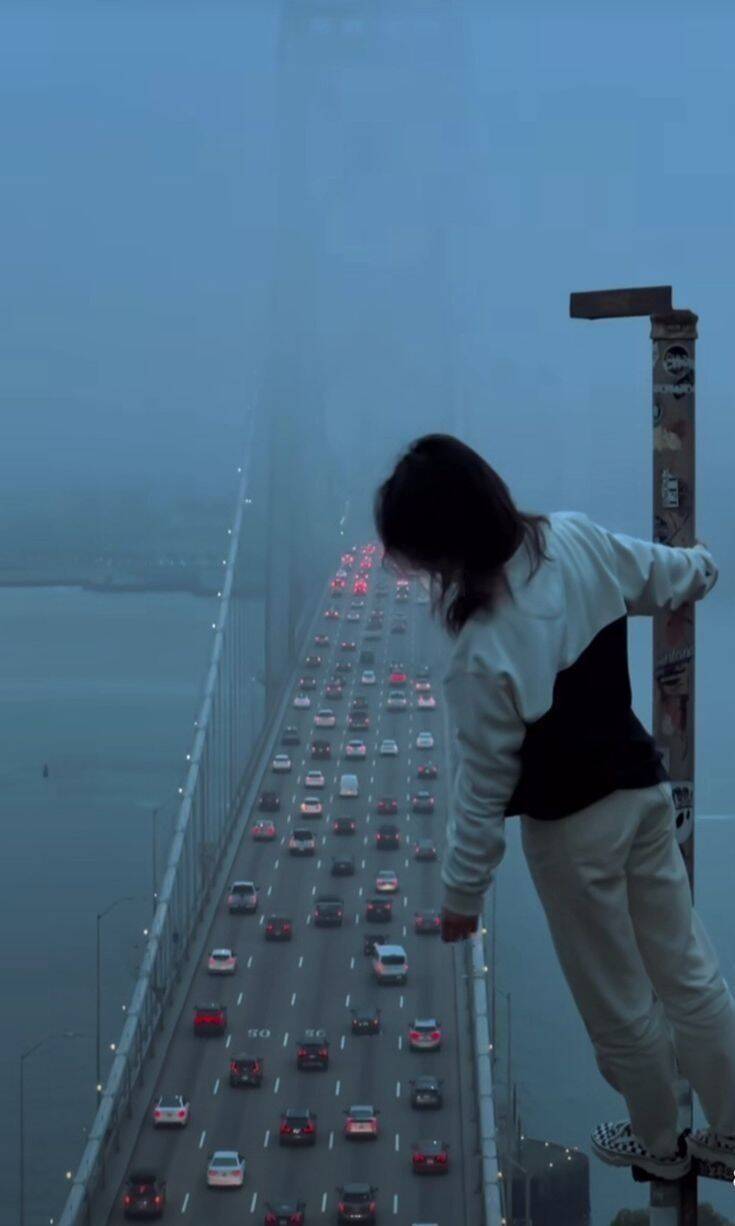 Picture for Sad Pfp Profile of a Woman on the Bridge on a Clordy Day