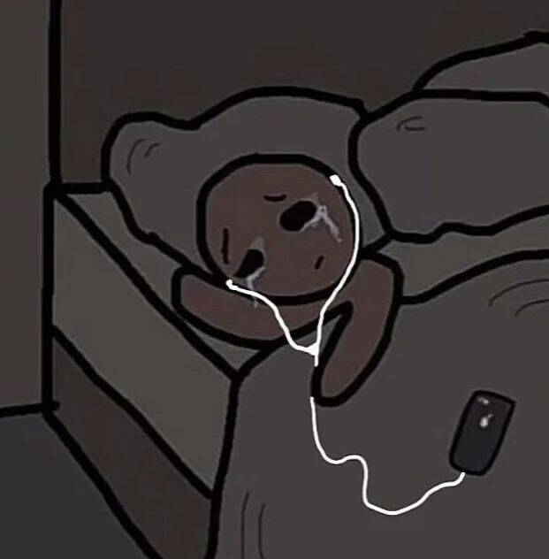 Foto de perfil triste de una persona acostada con auriculares