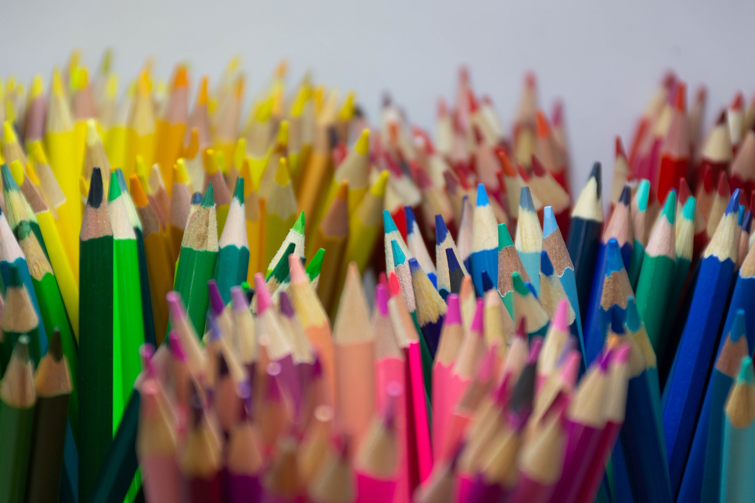 A colorful close-up of sharpened colored pencils in a vibrant assortment.